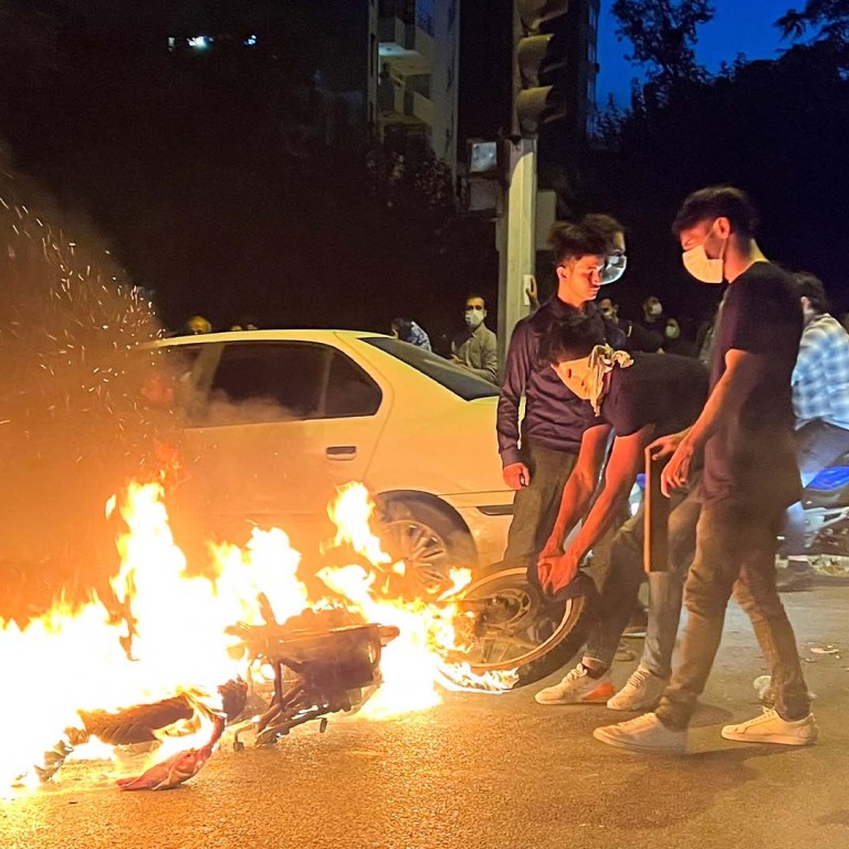 Security vehicles torched in Iran amid growing protests over woman's death in ‘morality police’ cust